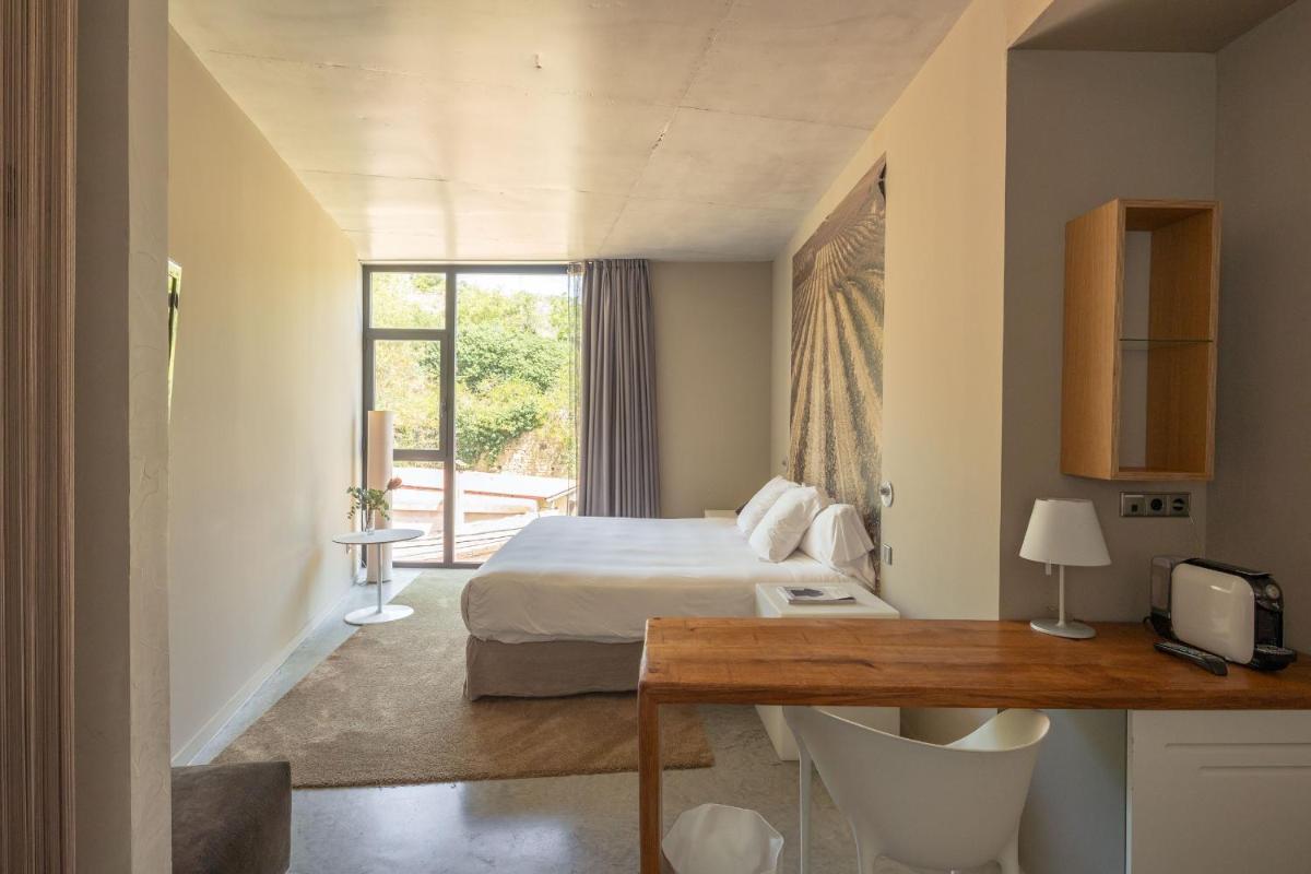 Cama o camas de una habitación en Hotel Viura