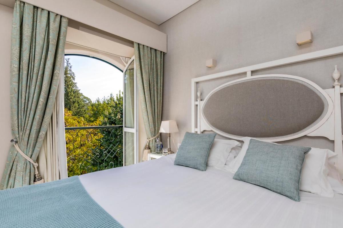 Uma cama ou camas num quarto em Grande Hotel das Caldas da Felgueira