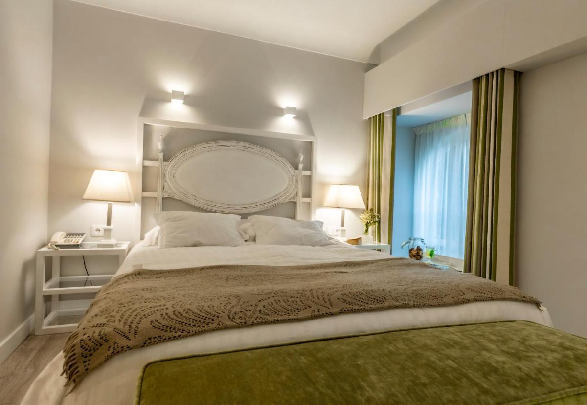 Uma cama ou camas num quarto em Grande Hotel das Caldas da Felgueira