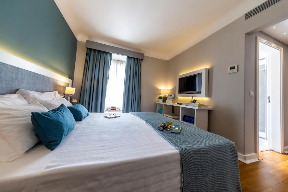 Uma cama ou camas num quarto em Grande Hotel das Caldas da Felgueira