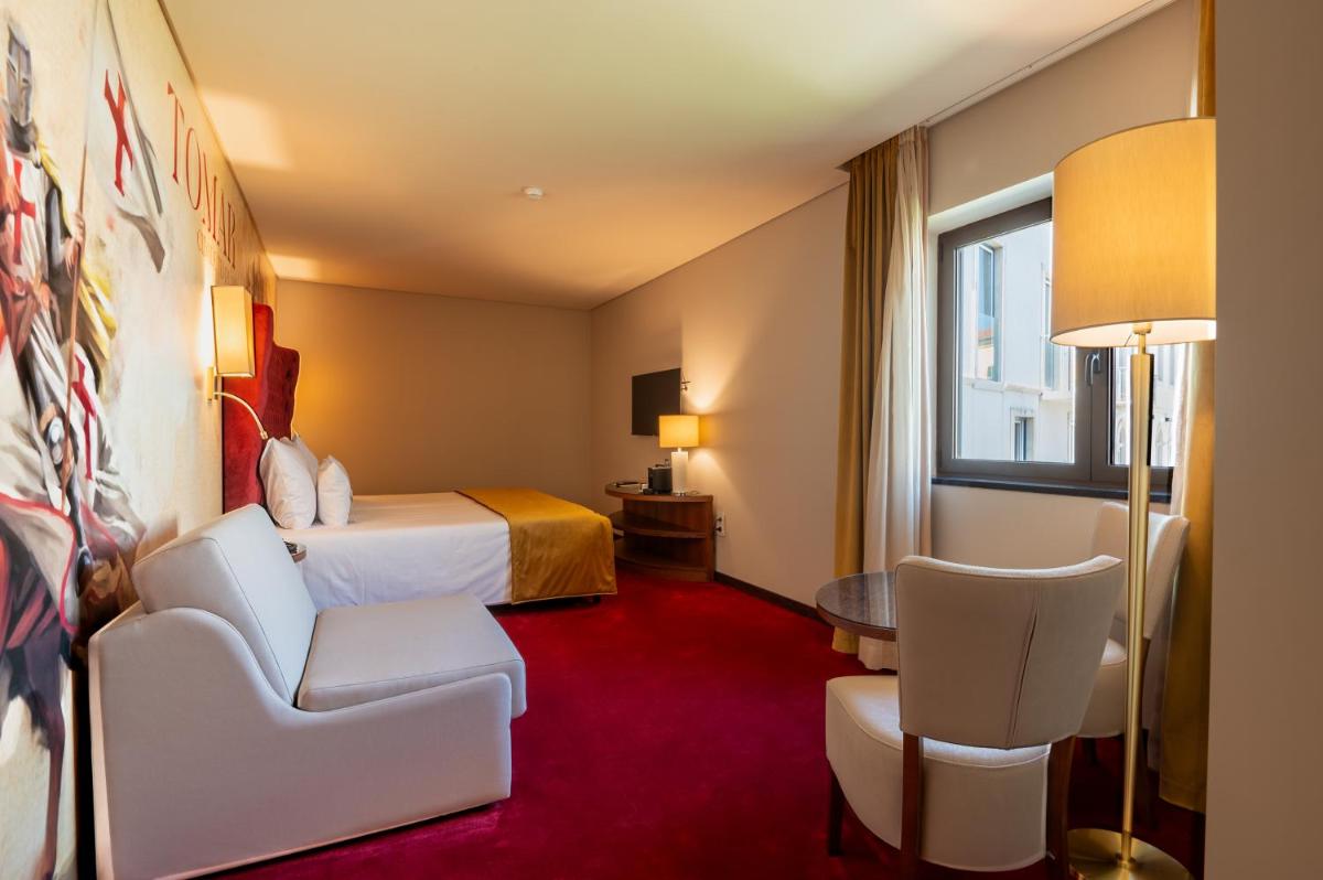 Uma cama ou camas num quarto em Vila Gale Collection Tomar