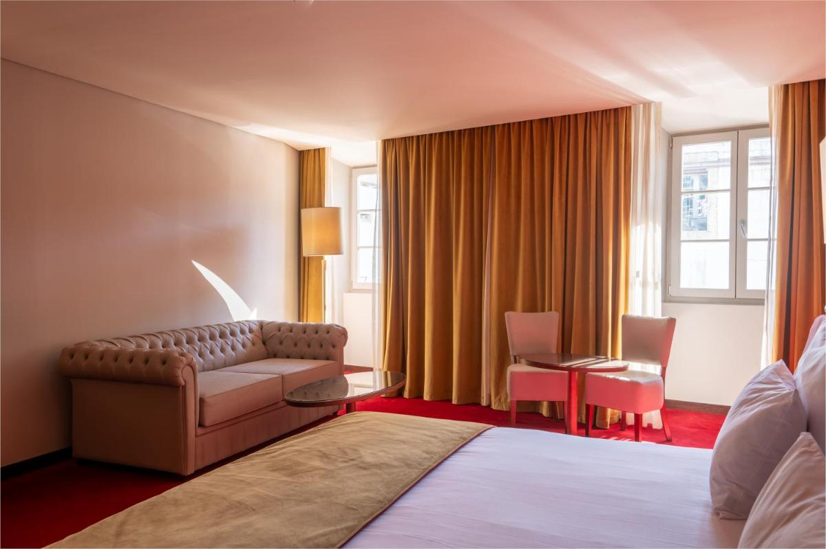 Uma cama ou camas num quarto em Vila Gale Collection Tomar