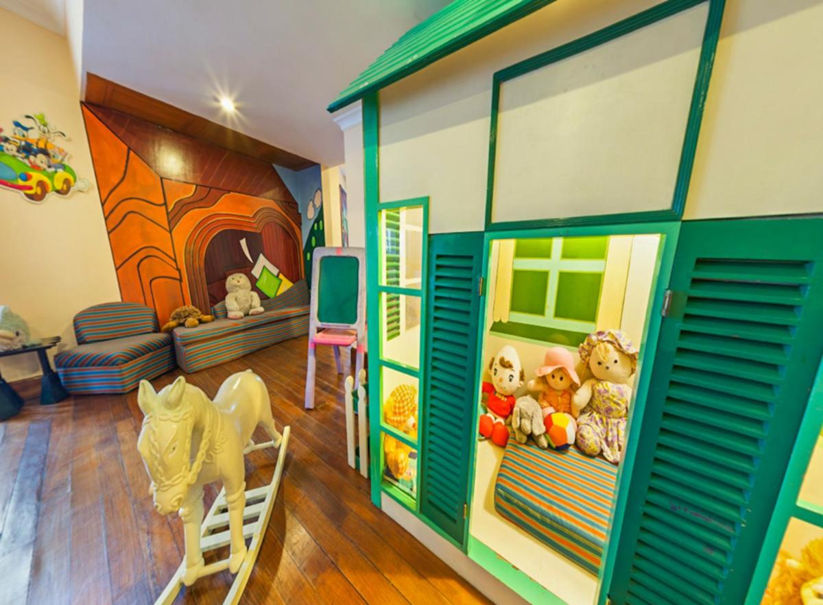 a room with a toy house with stuffed animals at The Oberoi Cecil in Shimla