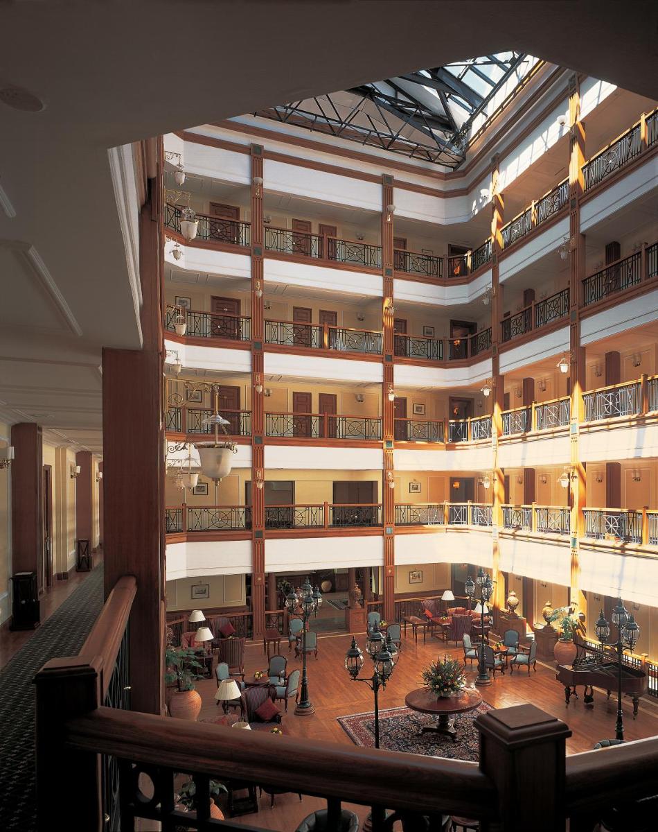 a view of a large building with tables and chairs at The Oberoi Cecil in Shimla