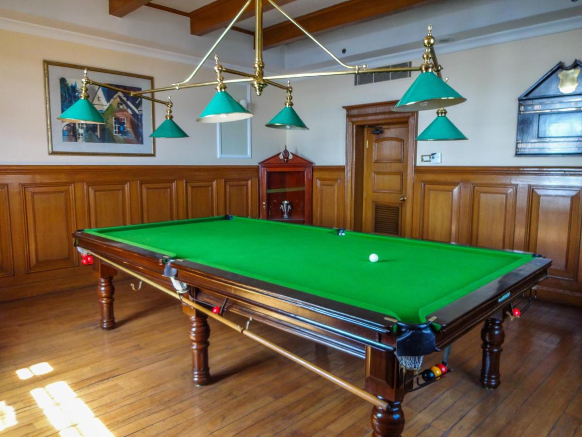 a billiard room with a pool table in it at The Oberoi Cecil in Shimla