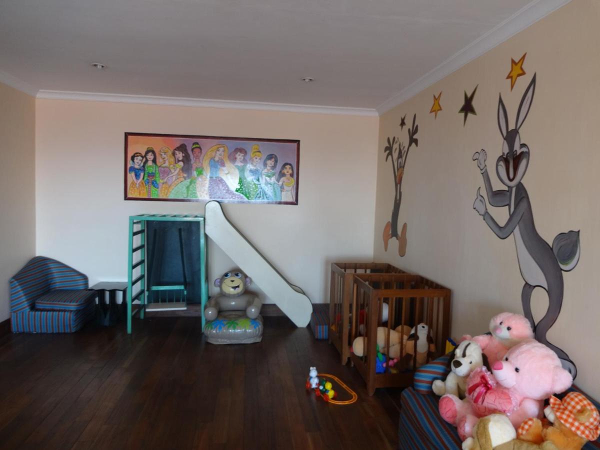 a childs room with a crib and toys in it at The Oberoi Cecil in Shimla