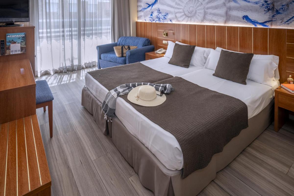 Cama o camas de una habitación en GHT Aquarium & Spa