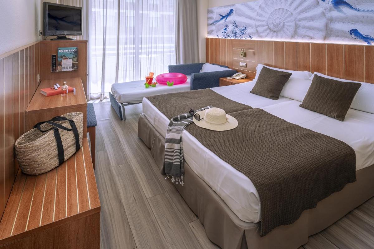 Cama o camas de una habitación en GHT Aquarium & Spa