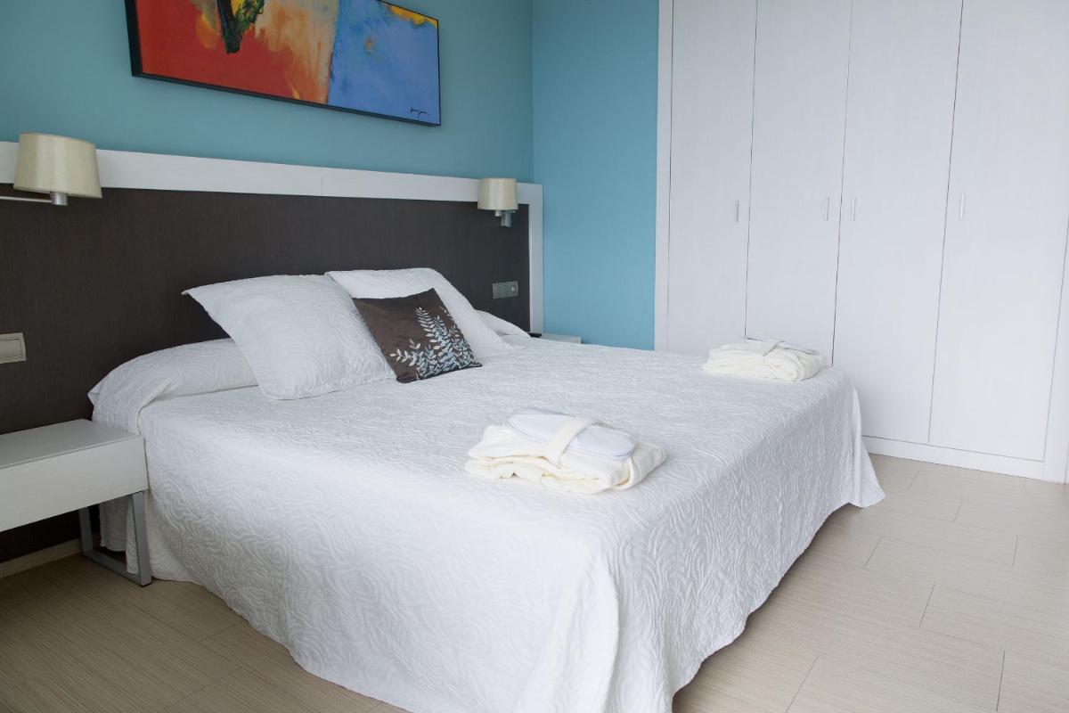 Cama o camas de una habitación en GHT Oasis Park & Spa