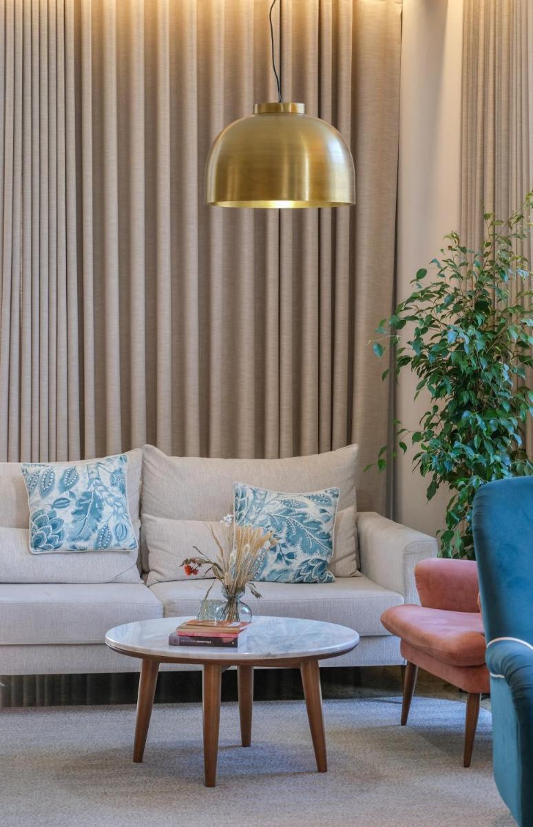 Uma área de estar em Hotel Vouga