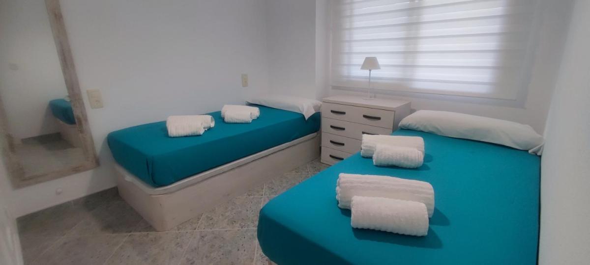 Acogedor apartamento en Daimús a 150 metros de la playa con parking privado y piscinas comunitarias - Housity