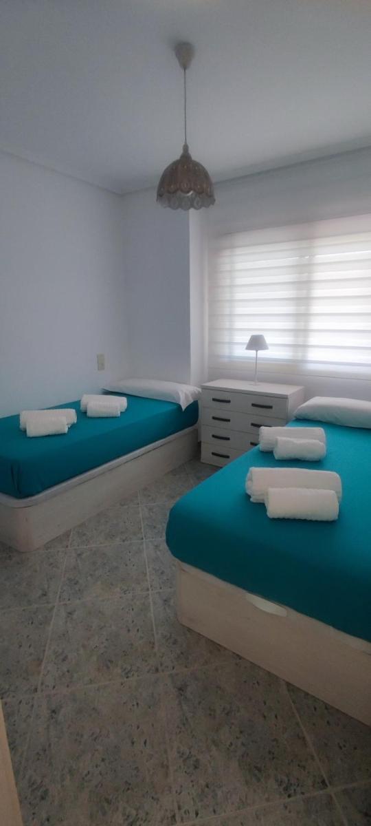 Acogedor apartamento en Daimús a 150 metros de la playa con parking privado y piscinas comunitarias - Housity
