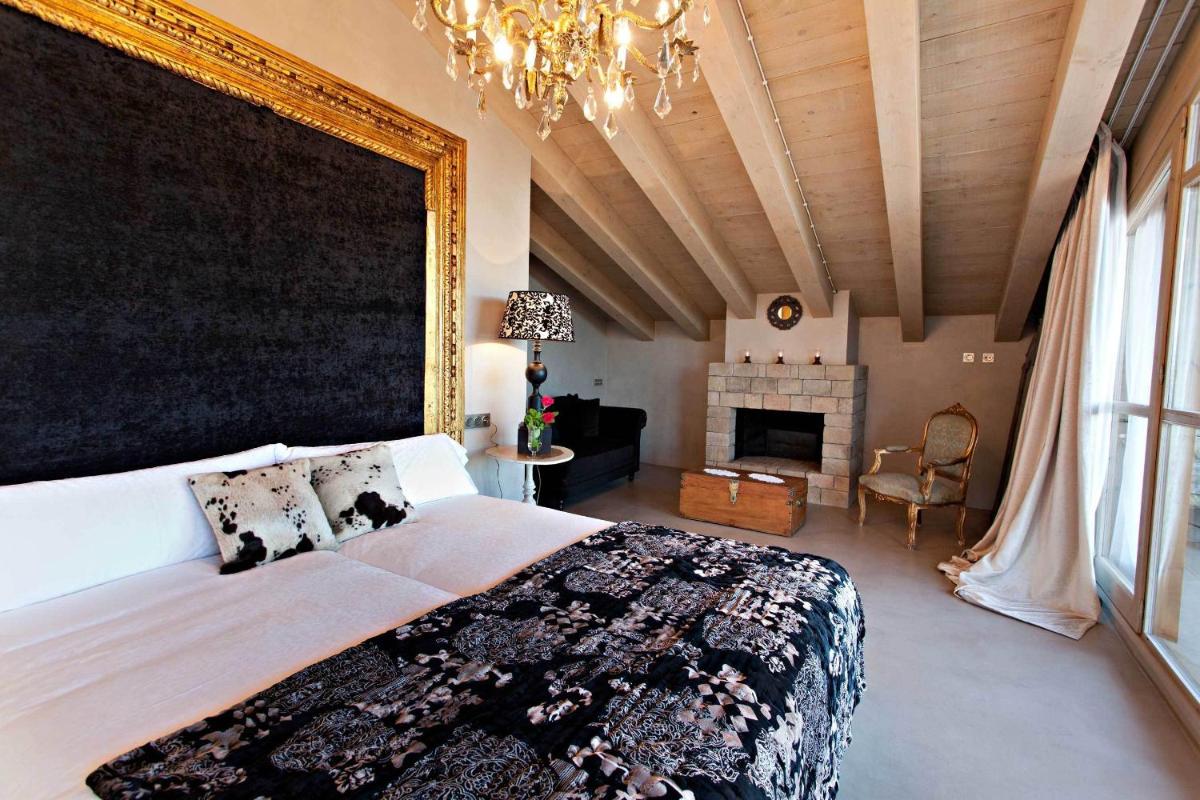 Cama o camas de una habitación en La Vella Farga Hotel