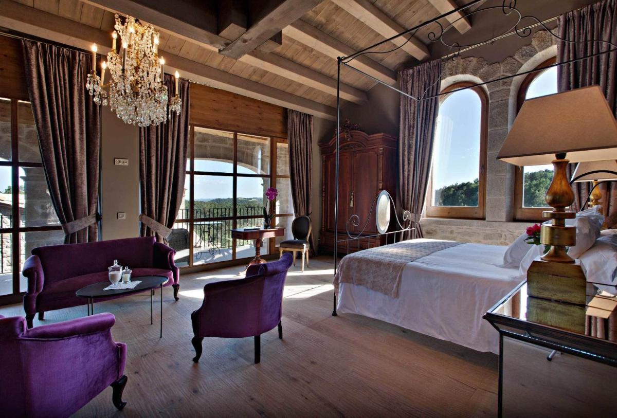 Cama o camas de una habitación en La Vella Farga Hotel