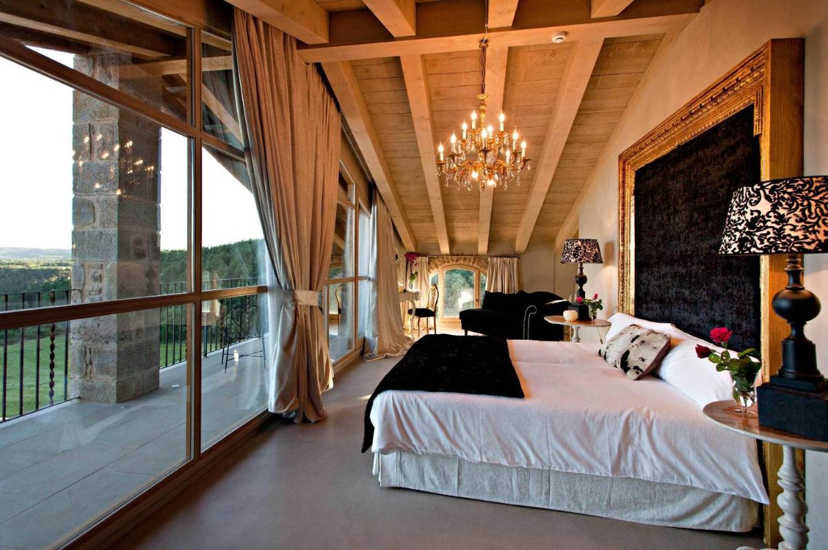 Cama o camas de una habitación en La Vella Farga Hotel