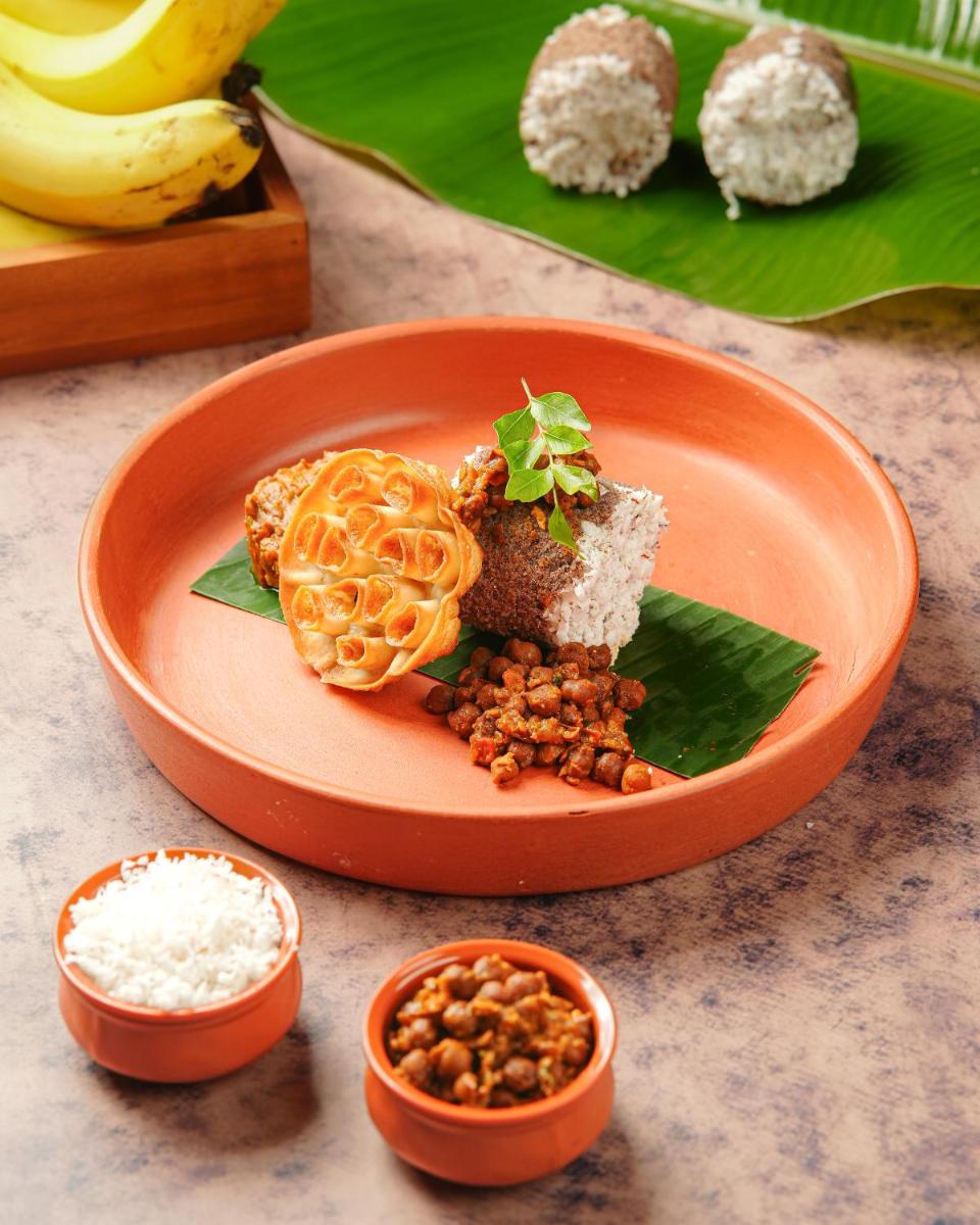 a plate of food with rice and nuts on a table at Sheraton Hyderabad Hotel in Hyderabad