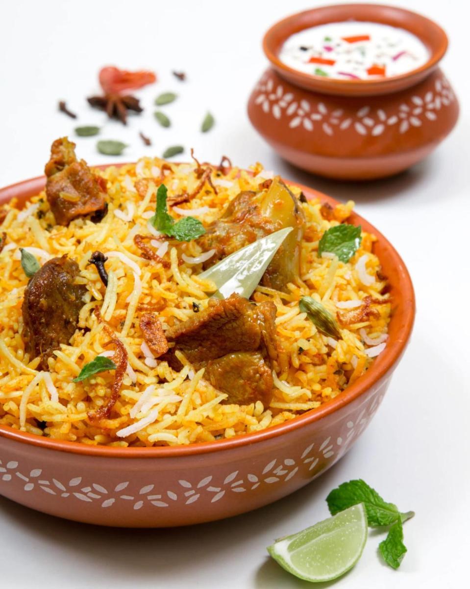 a bowl of food with meat and rice at Southern Star,Mysore in Mysore
