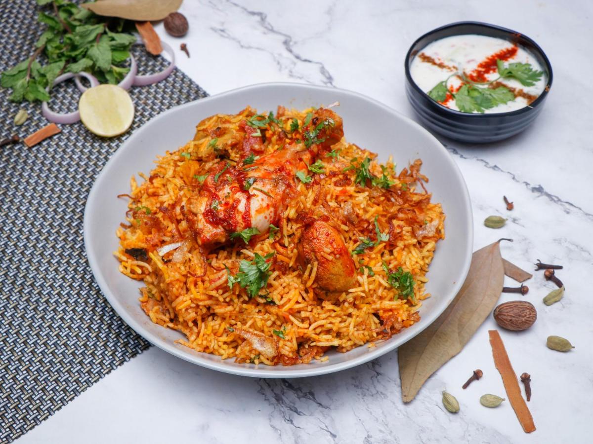 a bowl of rice with chicken and other ingredients at Southern Star,Mysore in Mysore