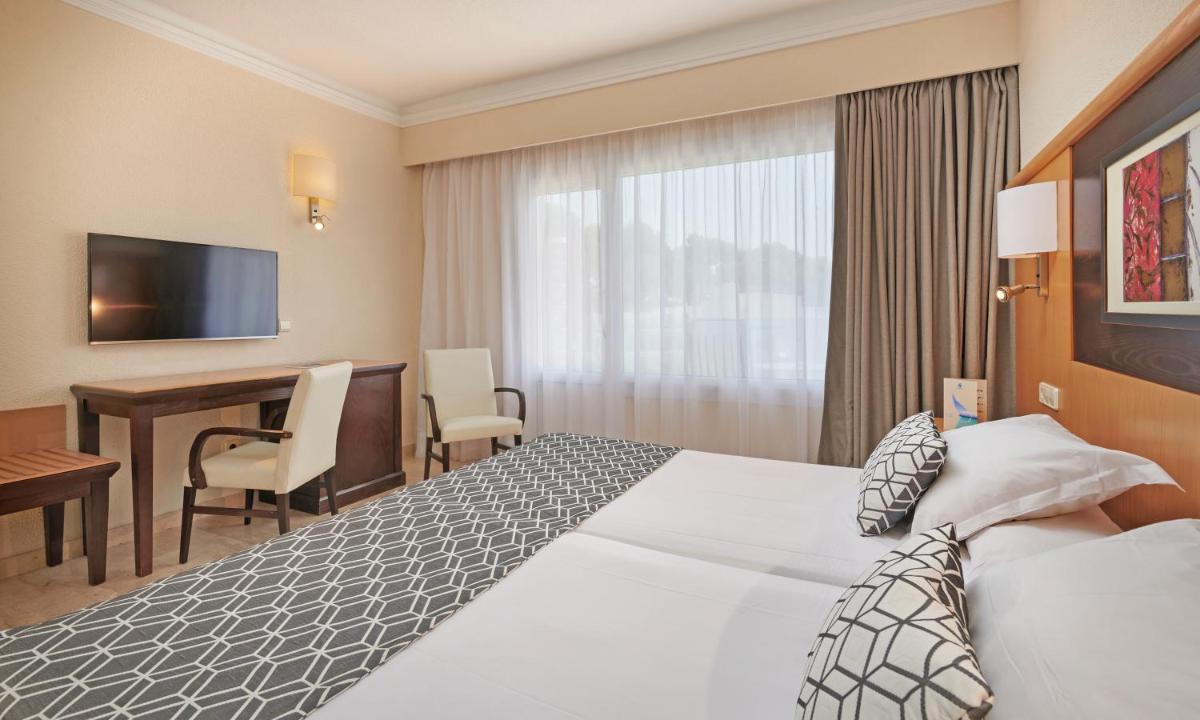 Cama o camas de una habitación en Grupotel Nilo & Spa