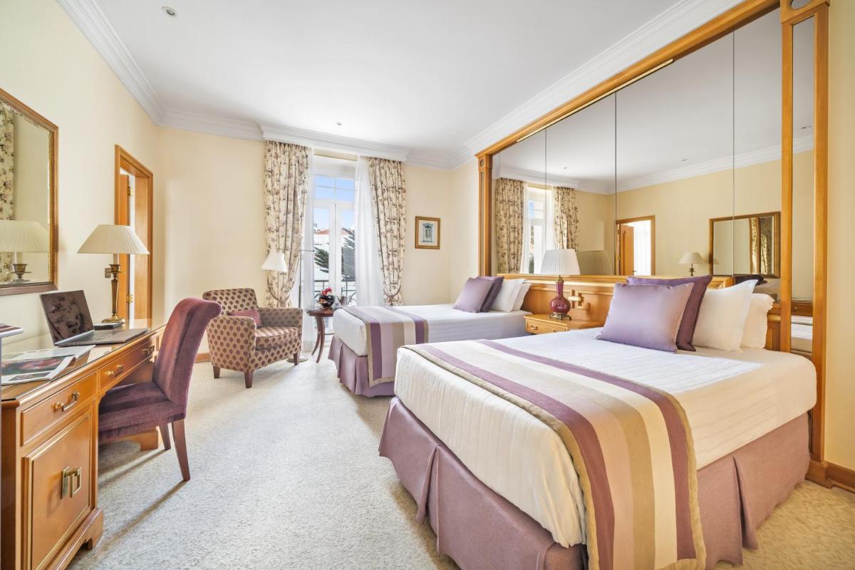 Uma cama ou camas num quarto em Palácio Estoril Hotel, Golf & Wellness