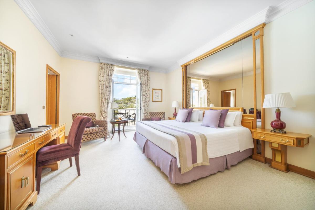 Uma cama ou camas num quarto em Palácio Estoril Hotel, Golf & Wellness