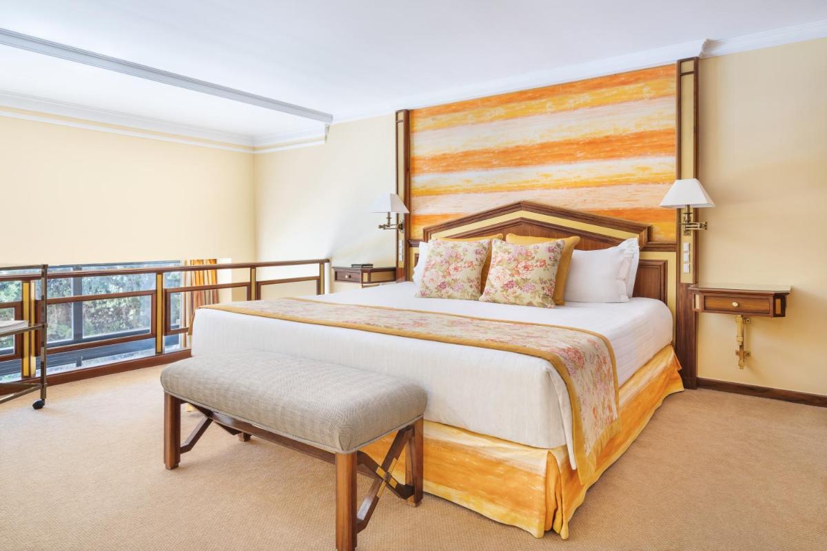 Uma cama ou camas num quarto em Palácio Estoril Hotel, Golf & Wellness