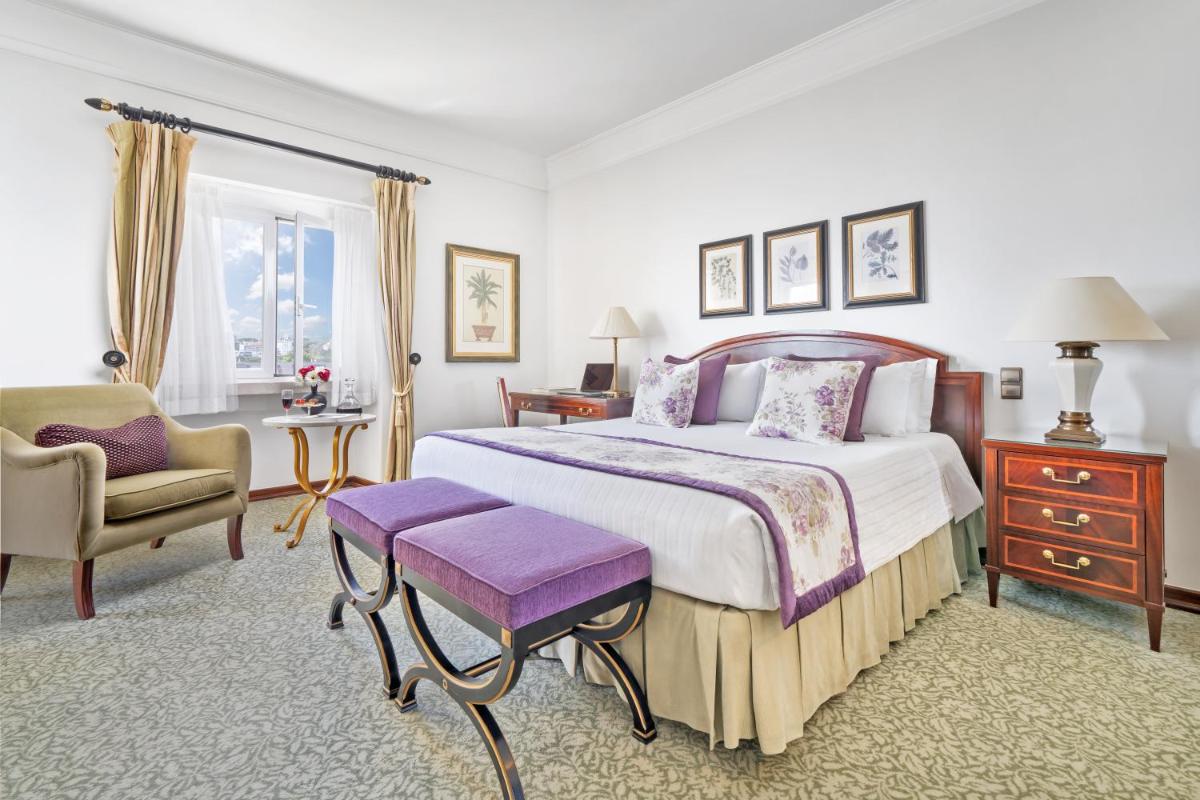 Uma cama ou camas num quarto em Palácio Estoril Hotel, Golf & Wellness