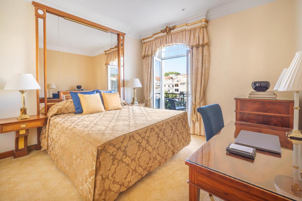 Uma cama ou camas num quarto em Palácio Estoril Hotel, Golf & Wellness