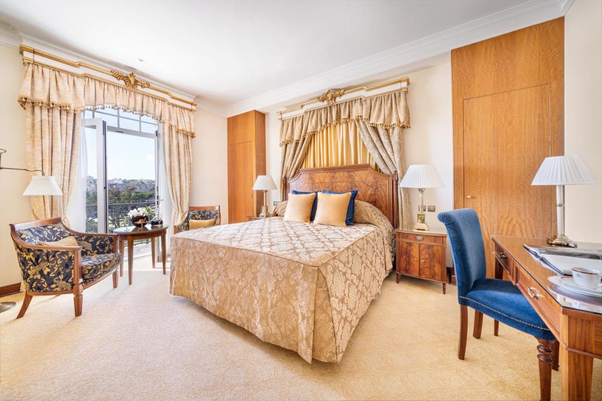 Uma cama ou camas num quarto em Palácio Estoril Hotel, Golf & Wellness