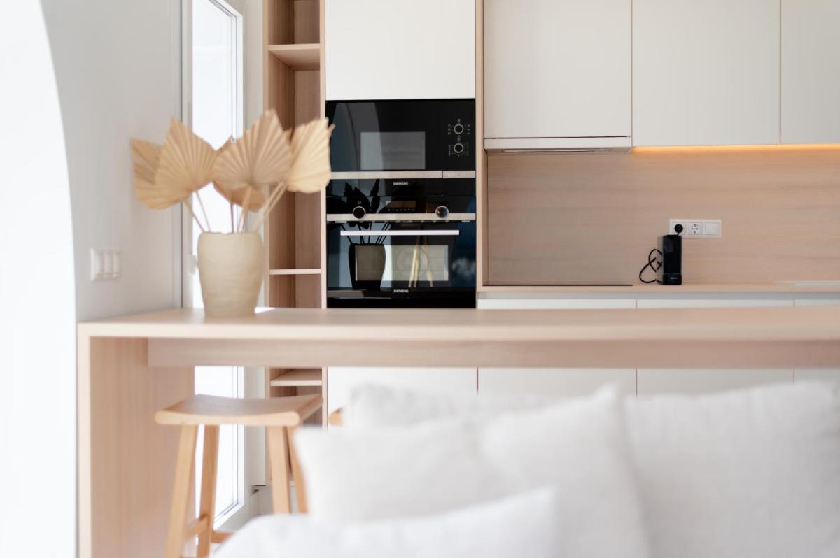 Una cocina o zona de cocina en Portomar Apartments - 4-Star Superior Hotel
