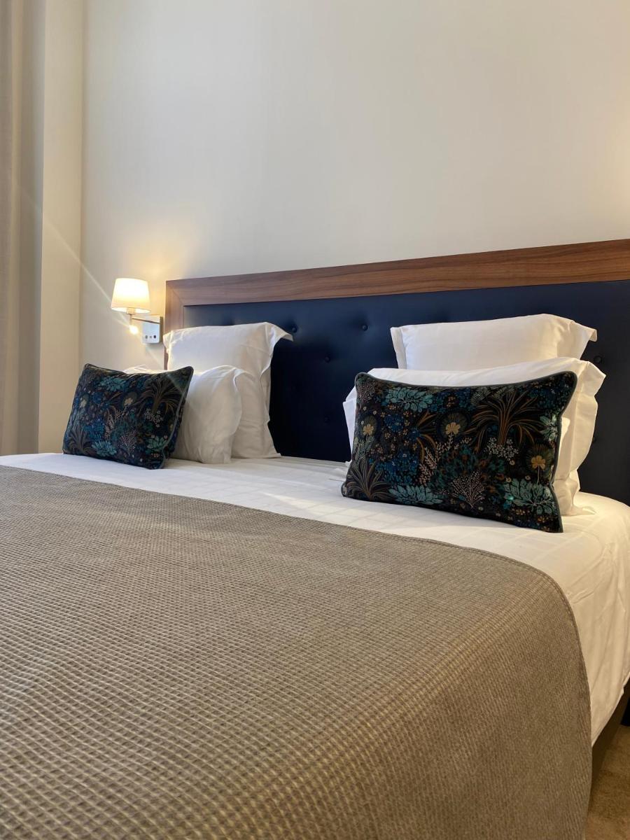 Un ou plusieurs lits dans un hébergement de l'établissement Westminster Hotel & Spa Nice