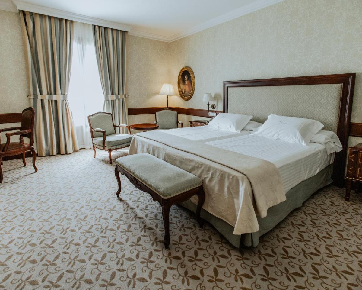 Cama o camas de una habitación en Hotel Cándido
