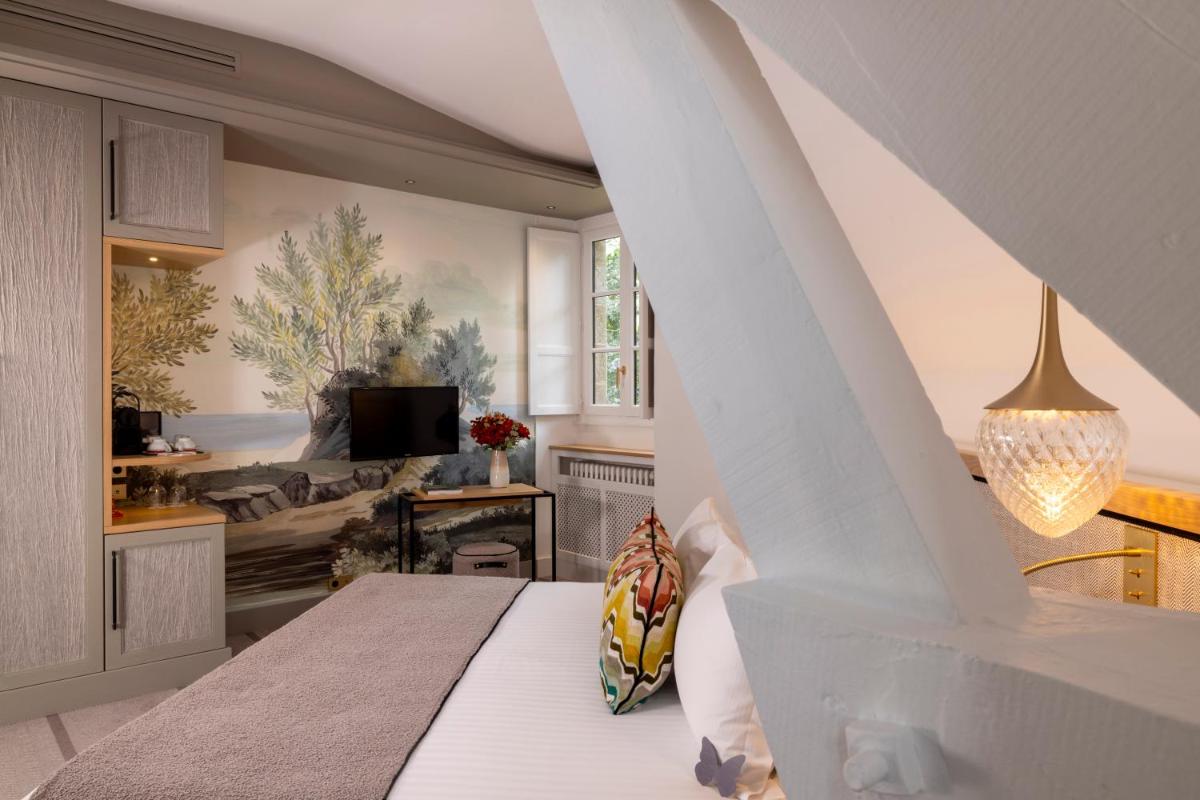 Télévision ou salle de divertissement dans l'établissement Hôtel & Spa de La Bretesche