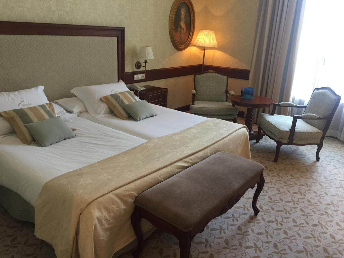 Cama o camas de una habitación en Hotel Cándido
