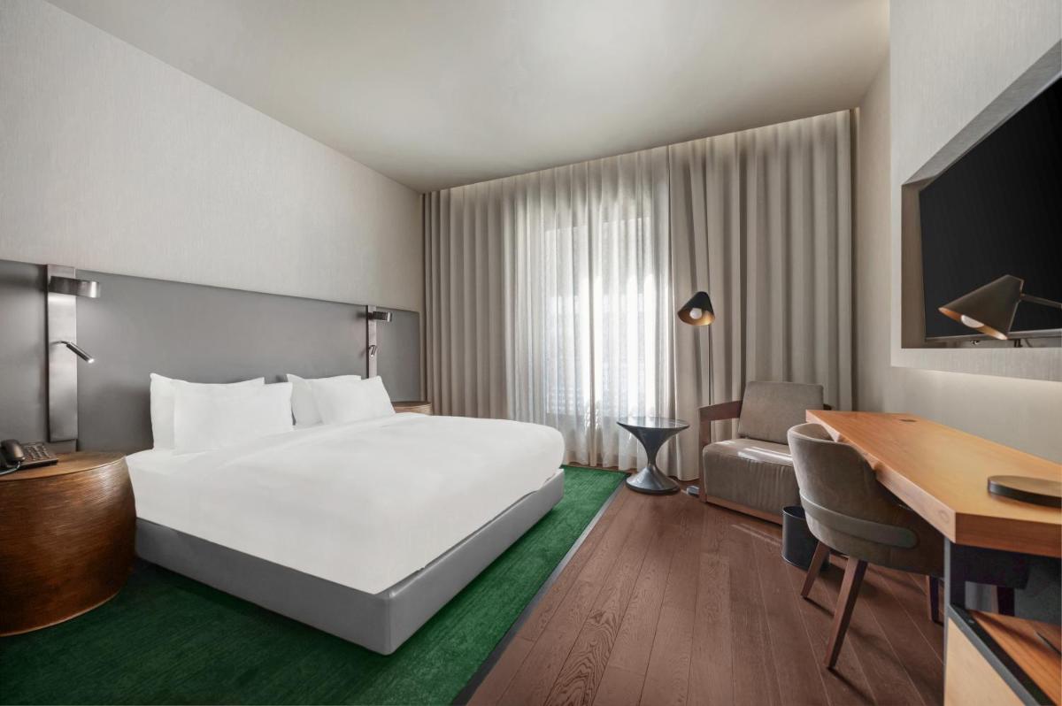 Uma cama ou camas num quarto em Hilton Porto Gaia