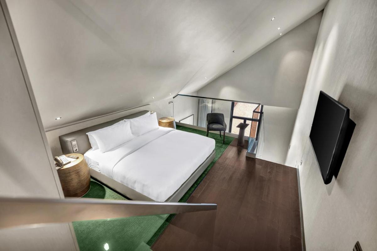Uma cama ou camas num quarto em Hilton Porto Gaia