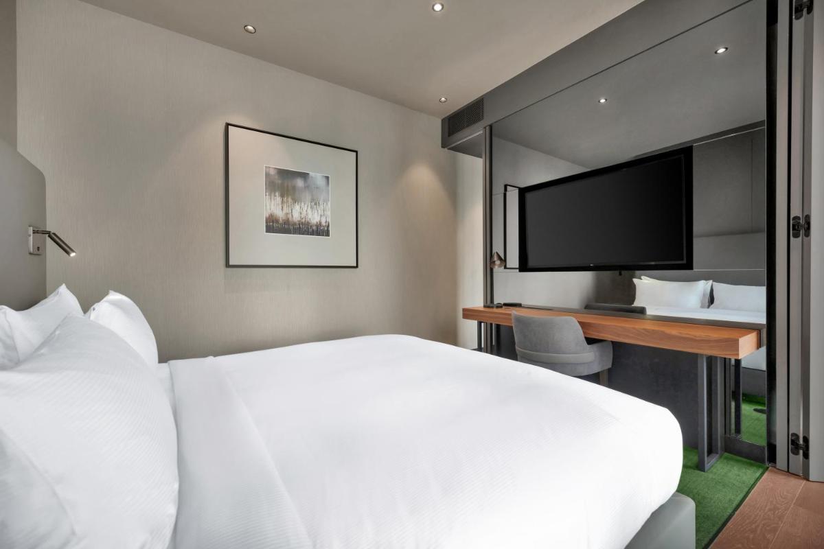Uma cama ou camas num quarto em Hilton Porto Gaia