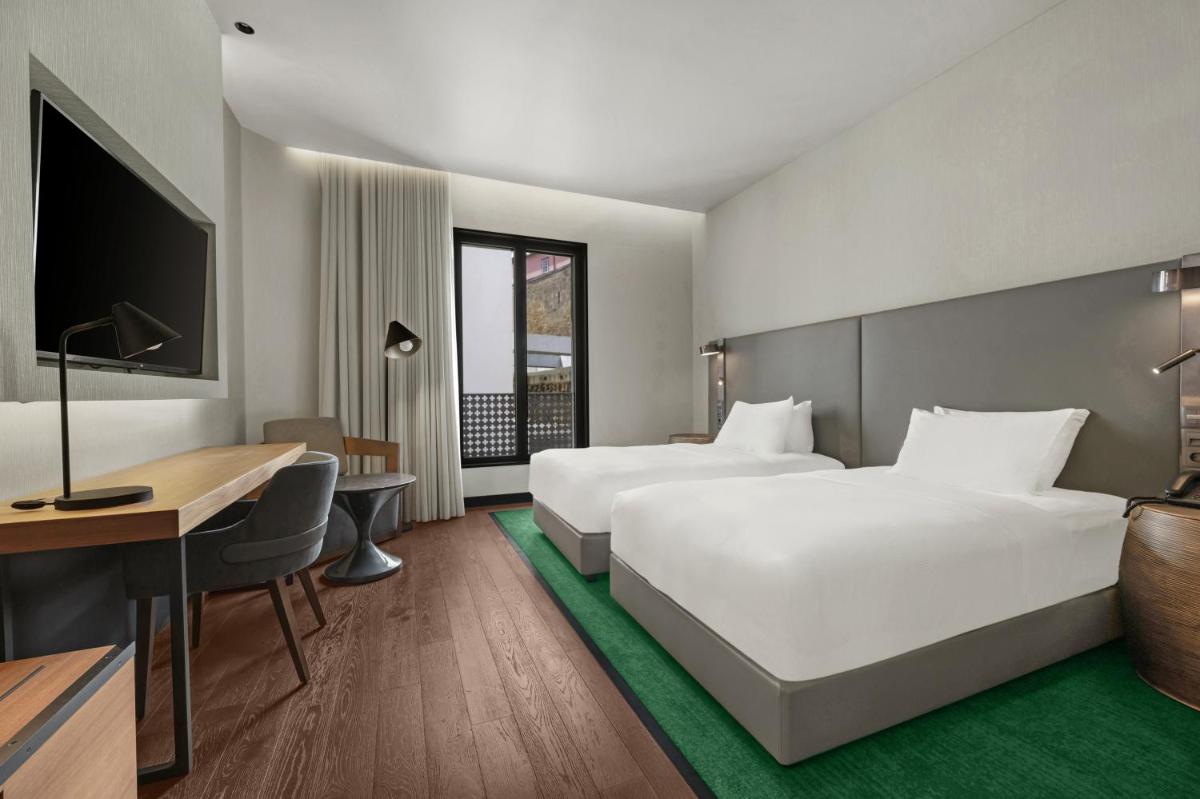 Uma cama ou camas num quarto em Hilton Porto Gaia