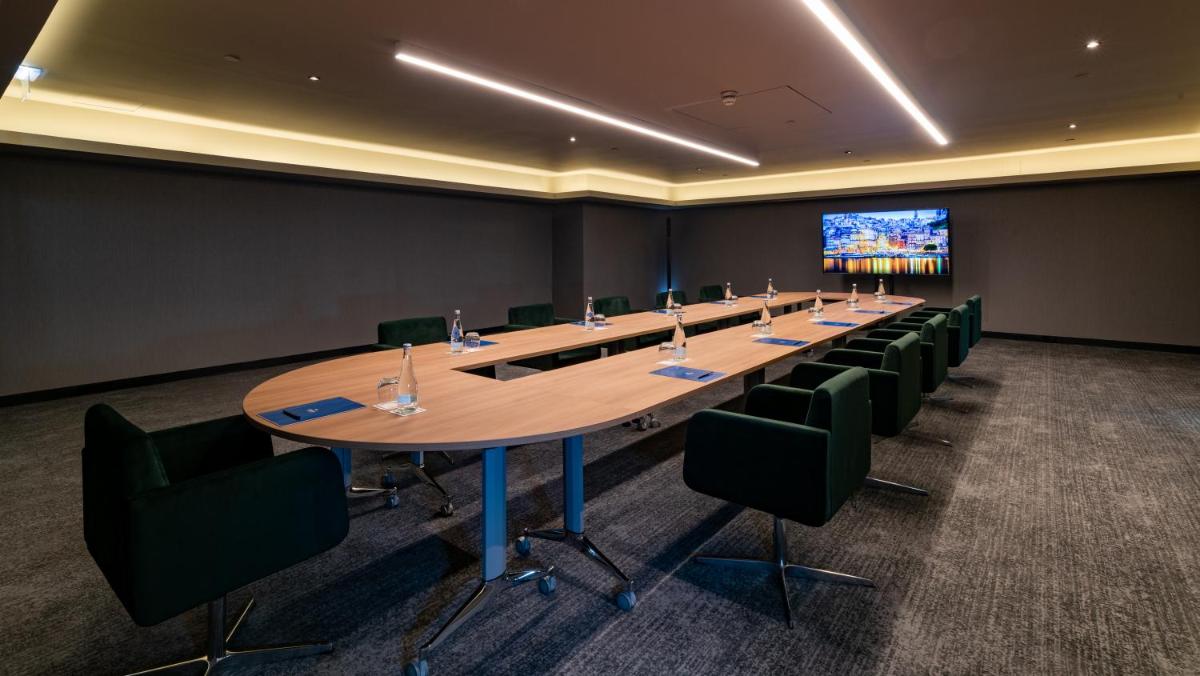 A área empresarial e/ ou a sala de conferências de Hilton Porto Gaia