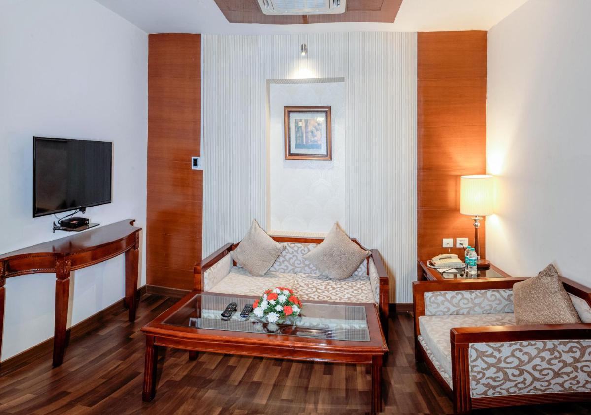 a living room with a couch and a coffee table at Fortune JP Palace, Mysore - Member ITC Hotels' Group in Mysore