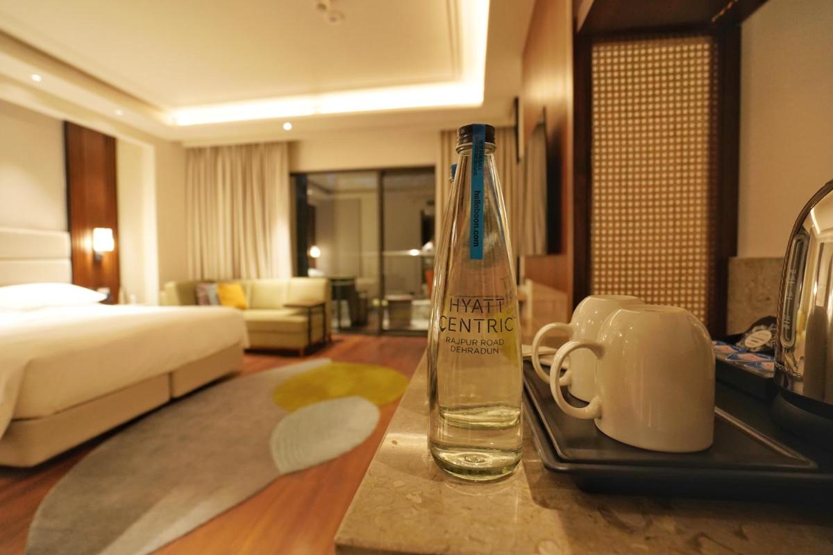 a bottle of water sitting on a table in a hotel room at Hyatt Centric Rajpur Road Dehradun in Dehradun