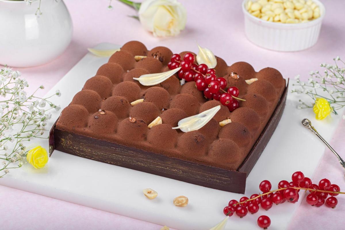 a chocolate cake in the shape of a heart on a table at JW Marriott Hotel New Delhi Aerocity in New Delhi a chocolate cake in the shape of a heart on a table at JW Marriott Hotel New Delhi Aerocity in New Delhi