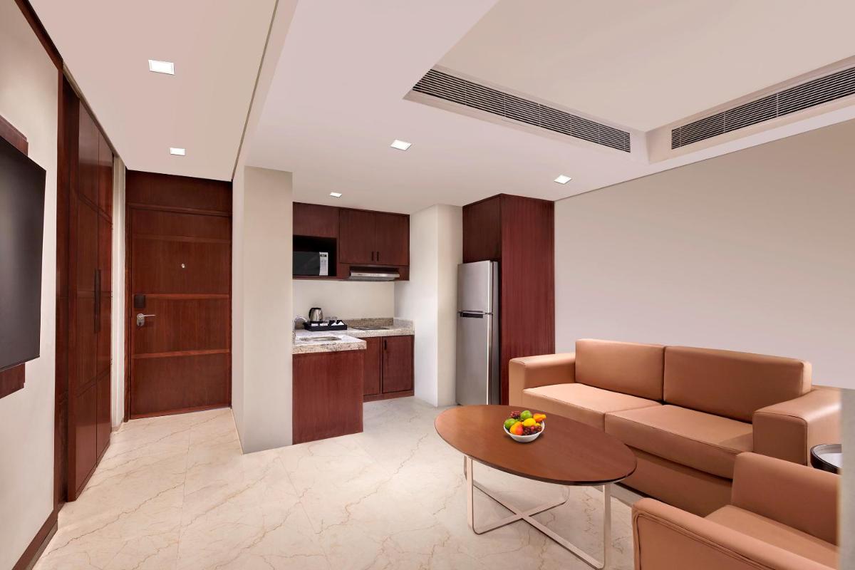 a living room with a couch and a table at Hyatt Regency Chennai in Chennai