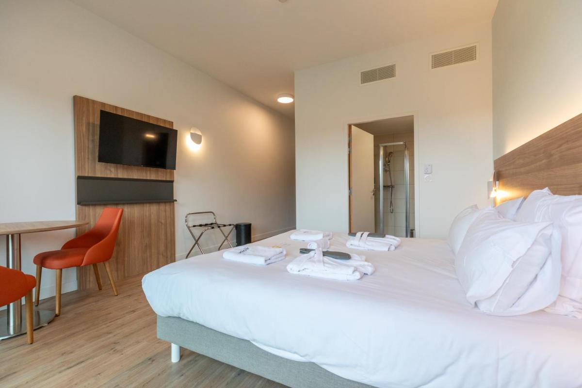 Un ou plusieurs lits dans un hébergement de l'établissement Villa Thermae Nancy