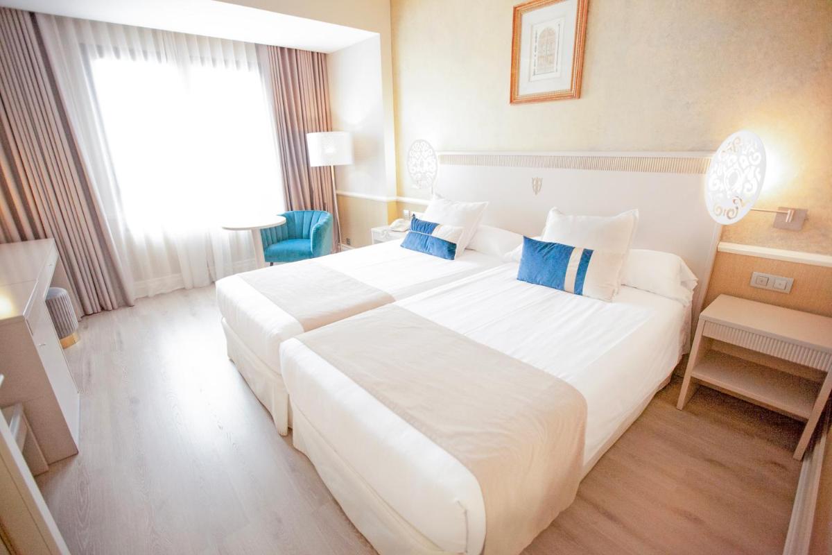 Cama o camas de una habitación en Hotel Alfonso VIII