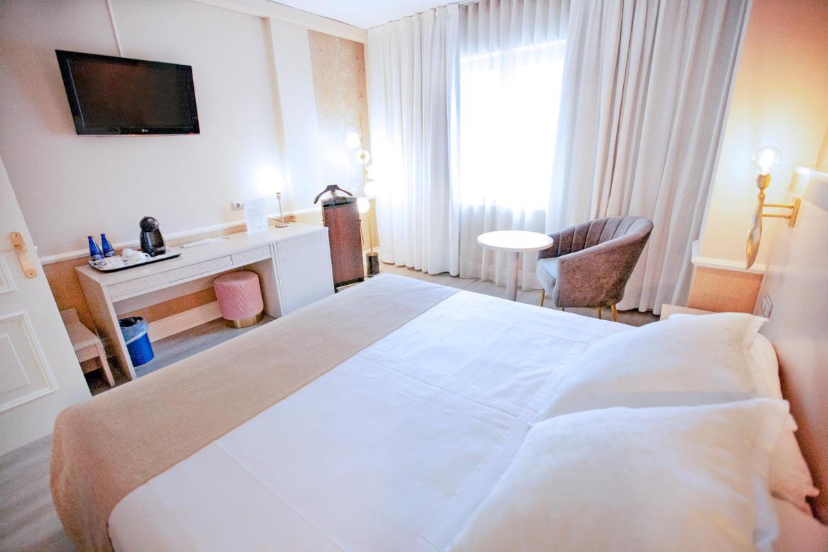 Cama o camas de una habitación en Hotel Alfonso VIII