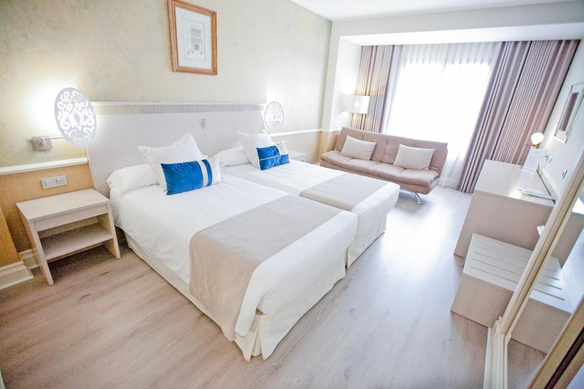 Cama o camas de una habitación en Hotel Alfonso VIII