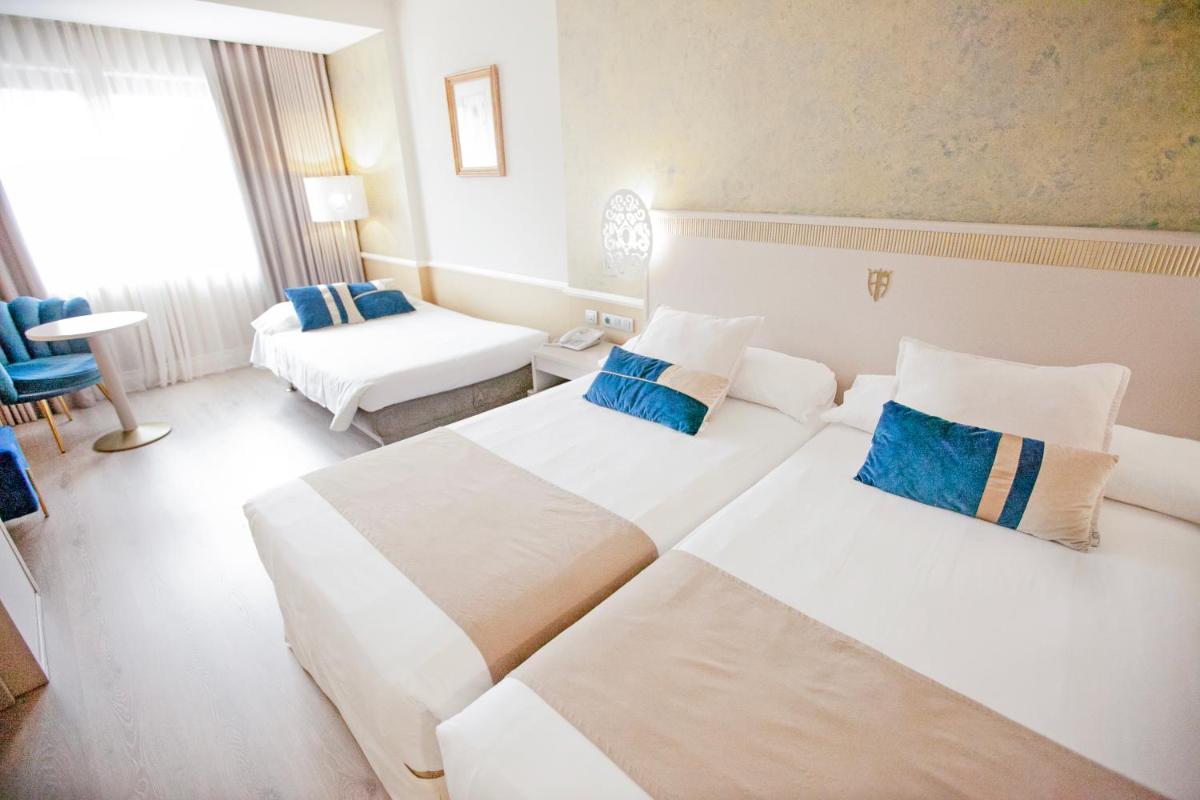 Cama o camas de una habitación en Hotel Alfonso VIII