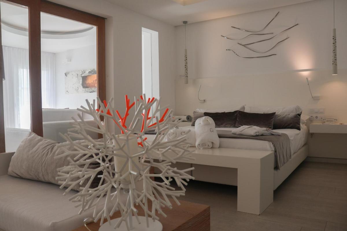 Cama o camas de una habitación en Hotel Cala Saona & Spa