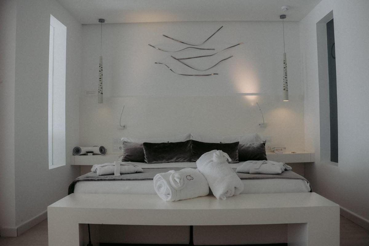 Cama o camas de una habitación en Hotel Cala Saona & Spa
